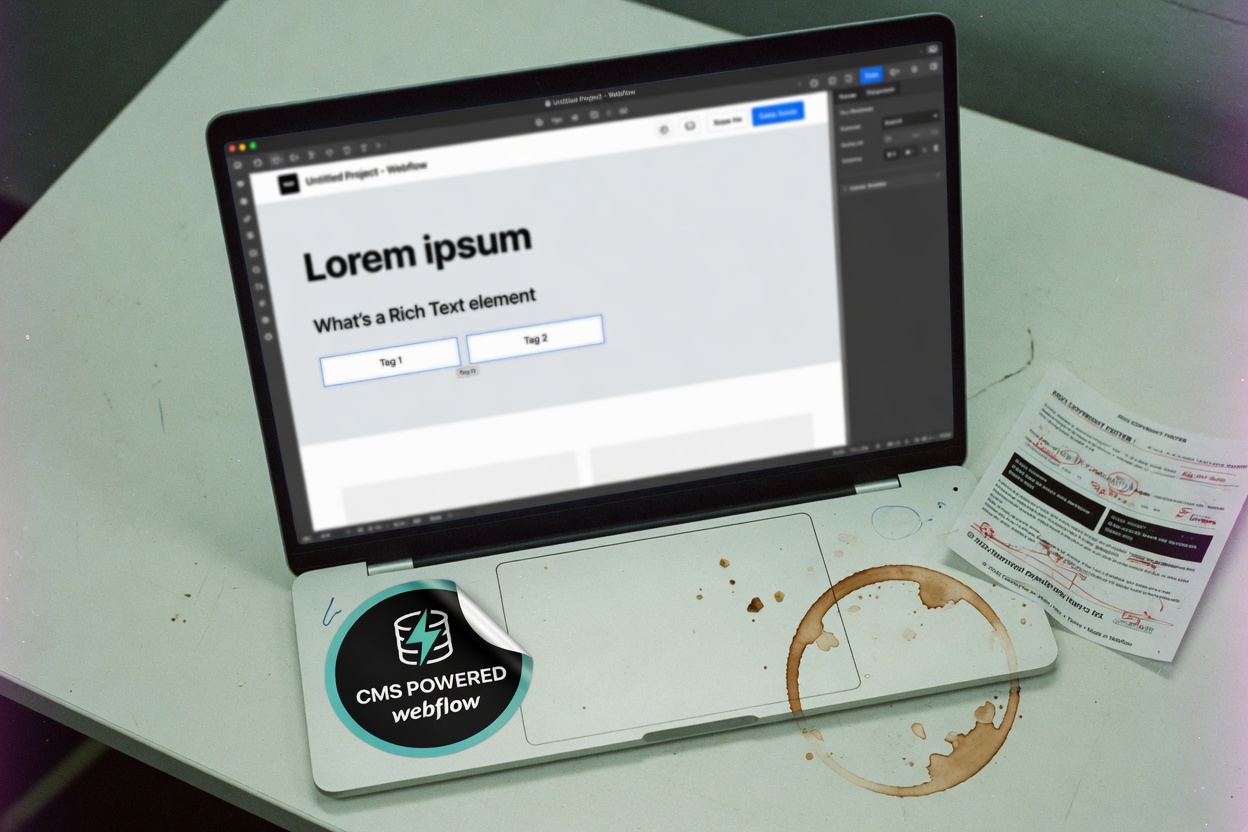 A laptop showing leftover Webflow CMS copy: Lorem ipsum, What's a Rich Text element, Tag 1 and Tag 2, with a coffee ring on the desk.